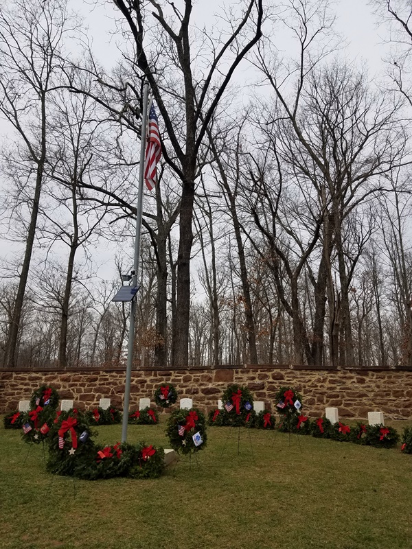 Balls Bluff National Cemetery, headstones decorated with wreaths, American flag