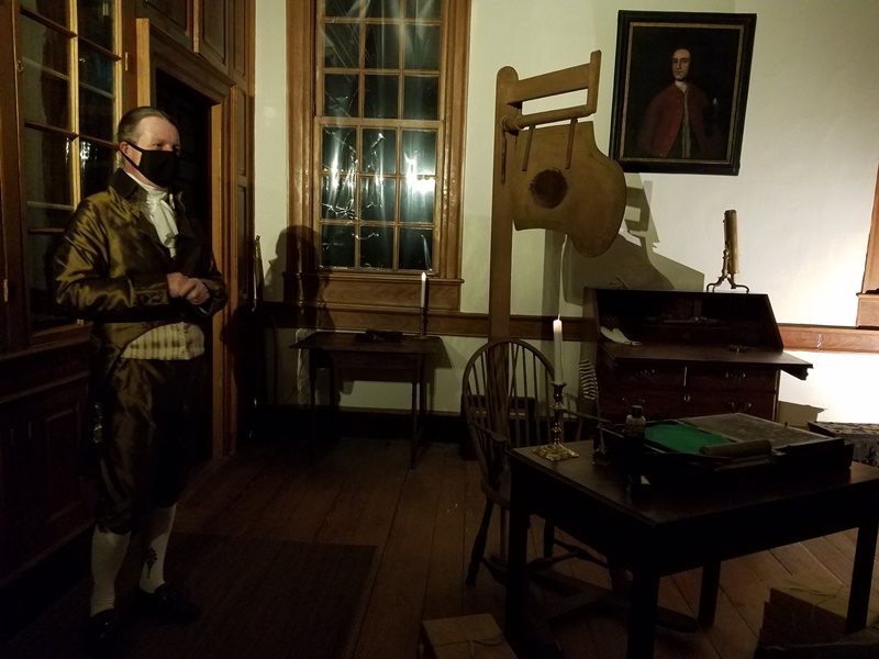 Costumed guide in George Washington's library room